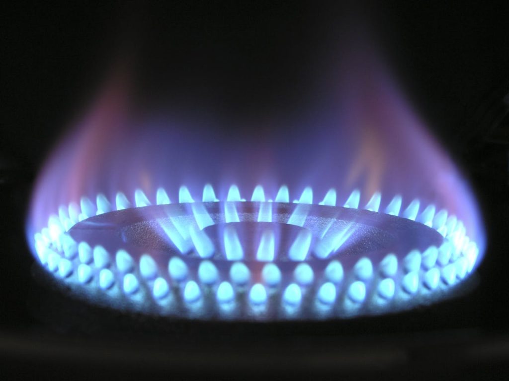burning-stove-266896 A detailed view of a blue flame on a gas stove, illustrating heat and warmth.